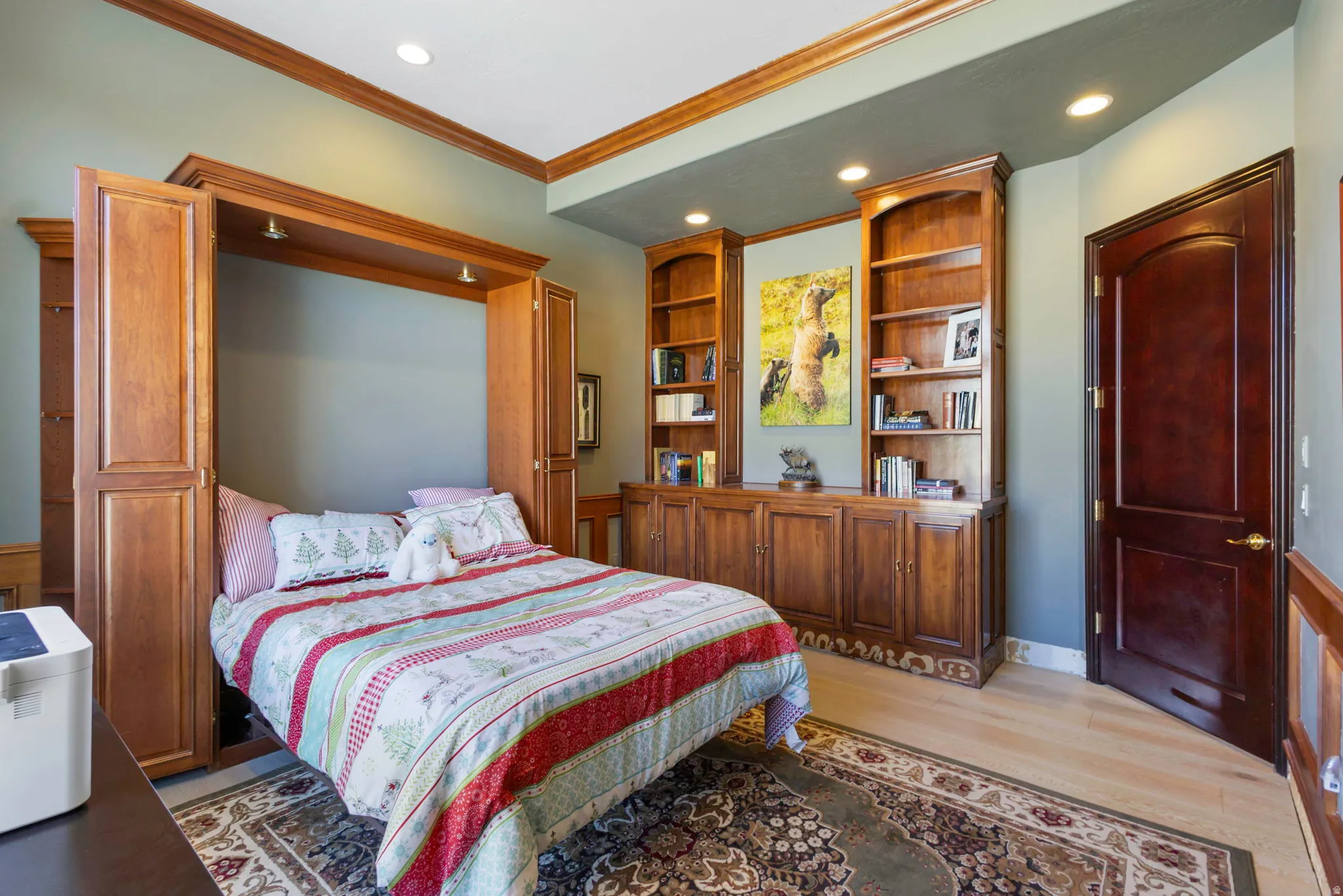 Bedroom with recessed lighting, light wood-style flooring, and crown molding