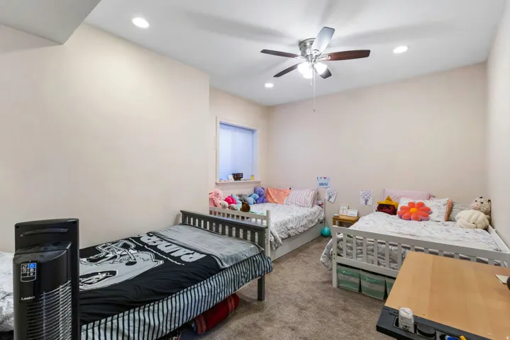 Bedroom featuring carpet flooring, recessed lighting, and a ceiling fan