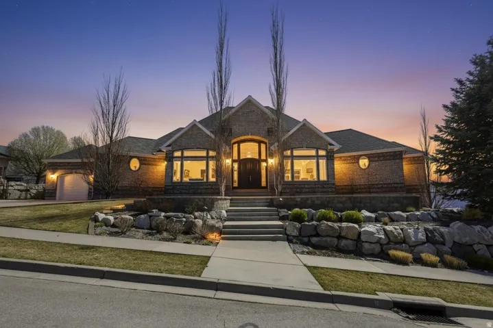 French provincial home featuring a garage