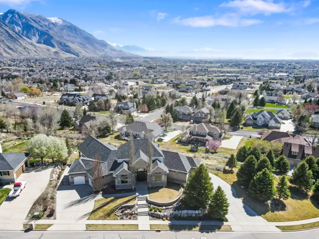 Aerial perspective of suburban area with a mountainous background