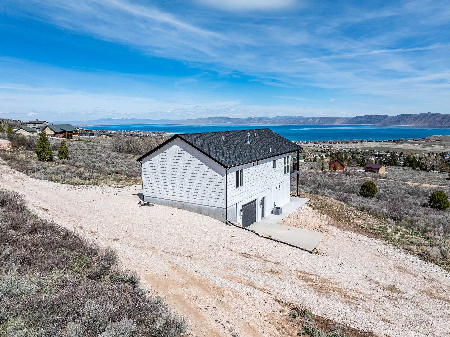 View of subject property with mountains and lake view