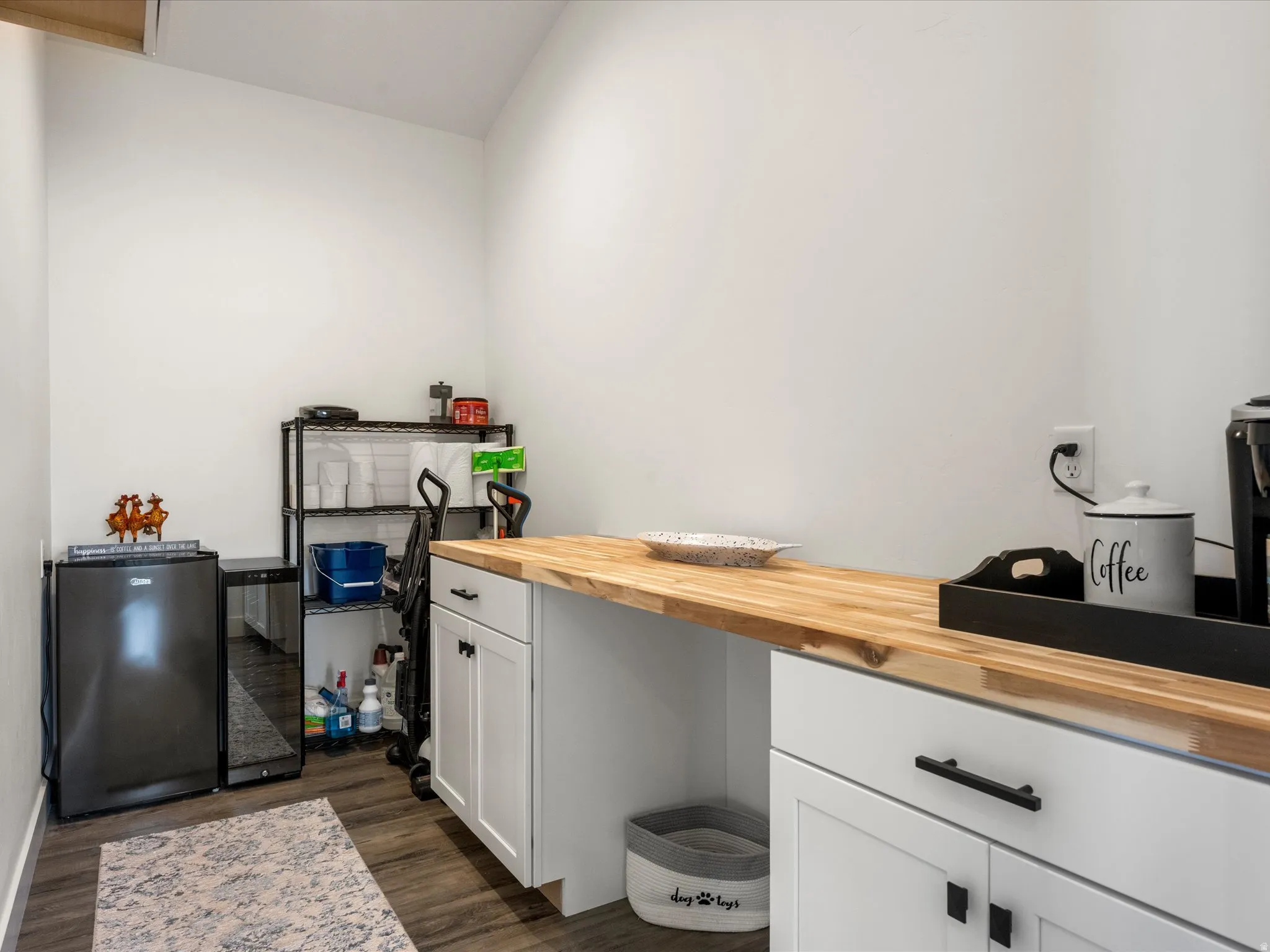 Miscellaneous room featuring dark wood-style flooring
