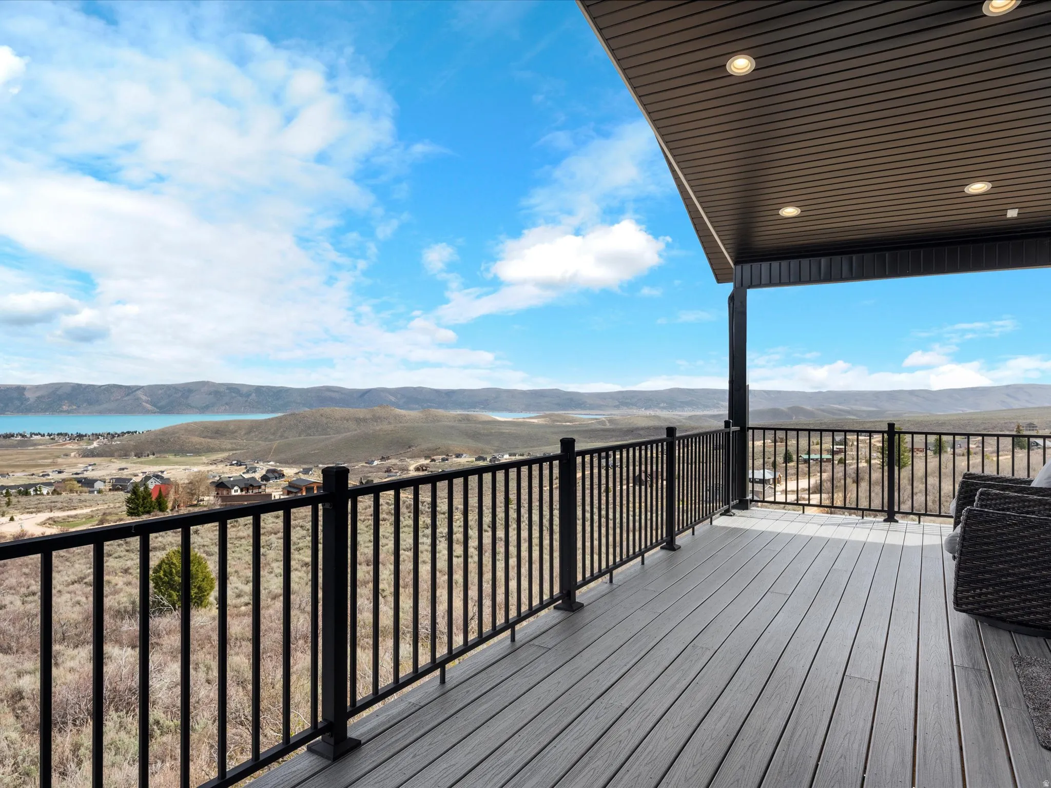 Deck with a mountain and lake view