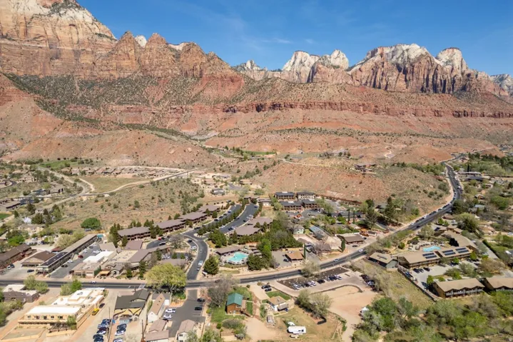 Aerial view of residential area featuring a mountainous background