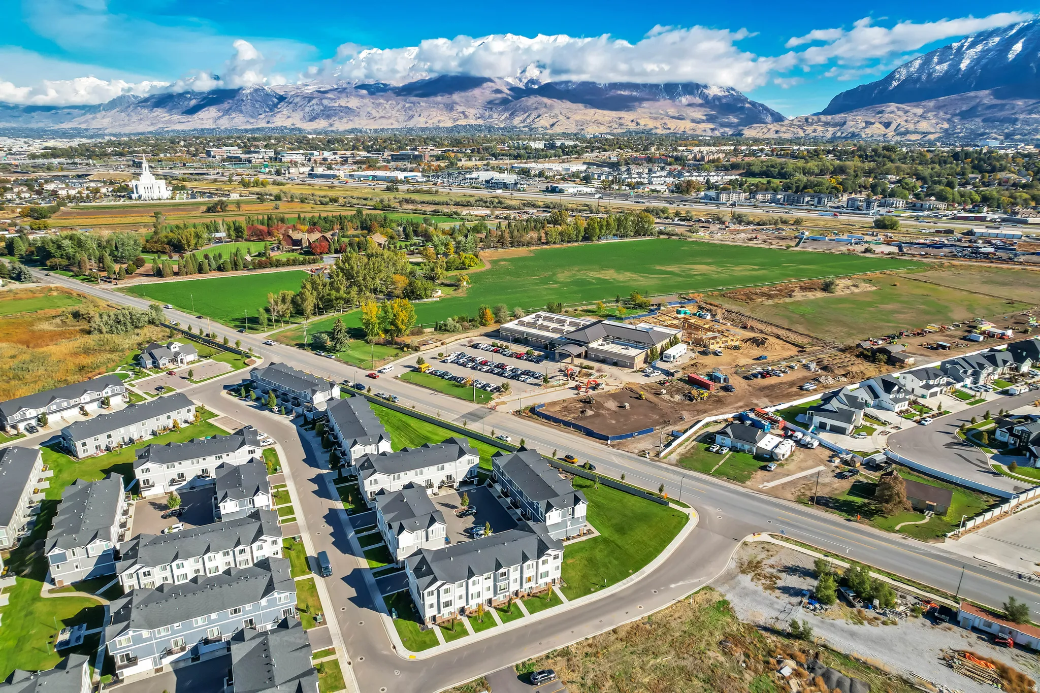 Aerial overview of properties location featuring a mountainous background