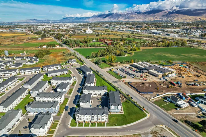 Aerial overview of properties location featuring a mountainous background
