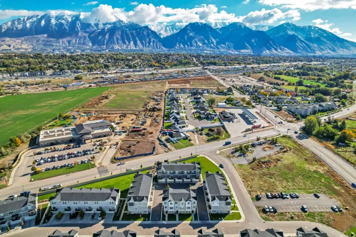 View of property location featuring mountains and nearby suburban area