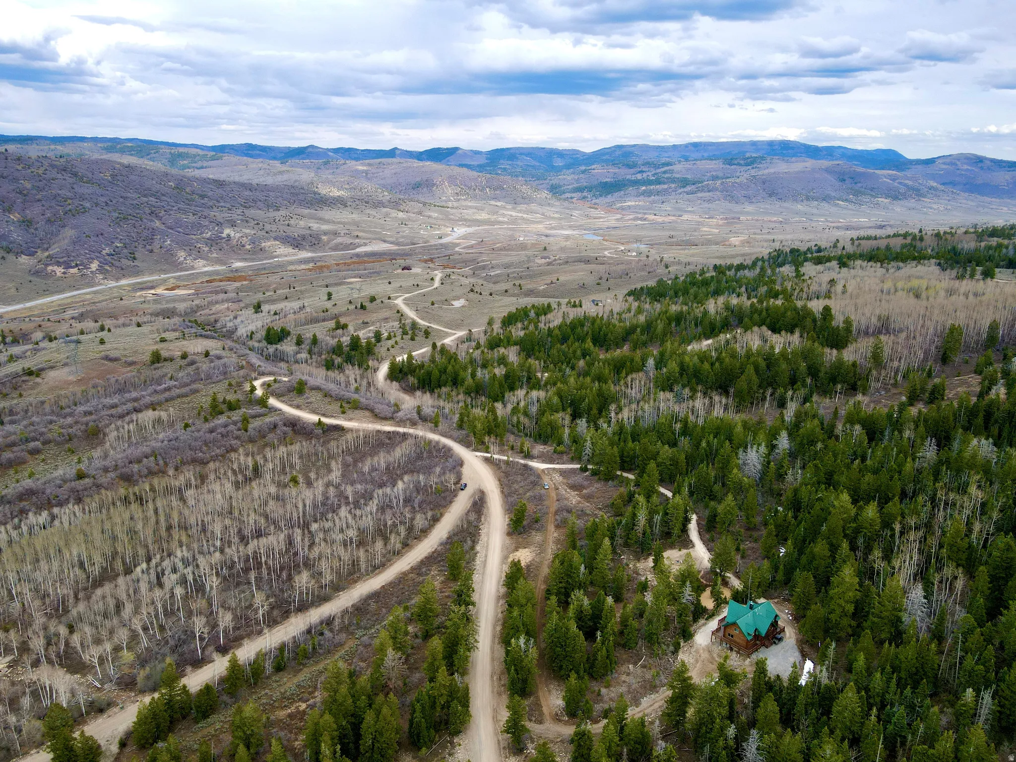Overview of rural landscape featuring a mountainous background