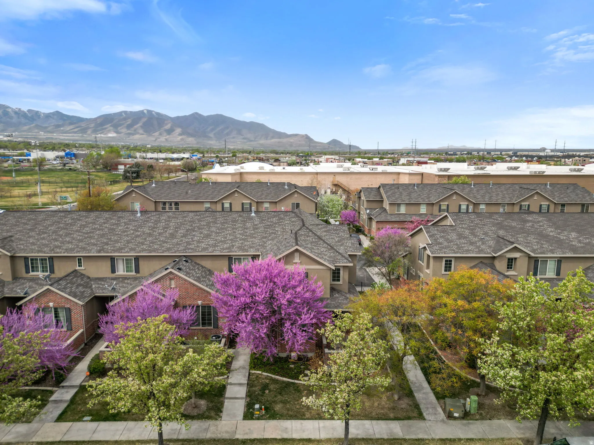 View of mountain backdrop featuring nearby suburban area
