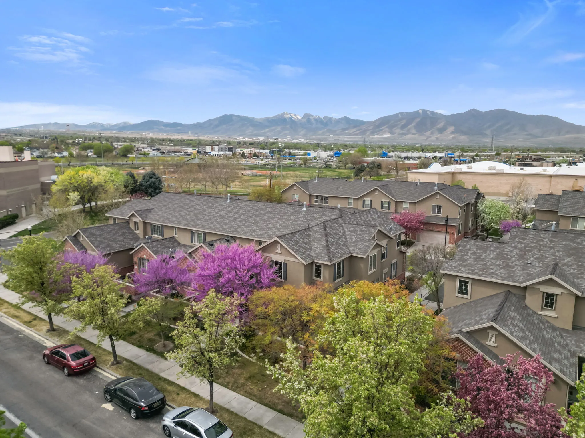 Aerial view of residential area featuring a mountainous background