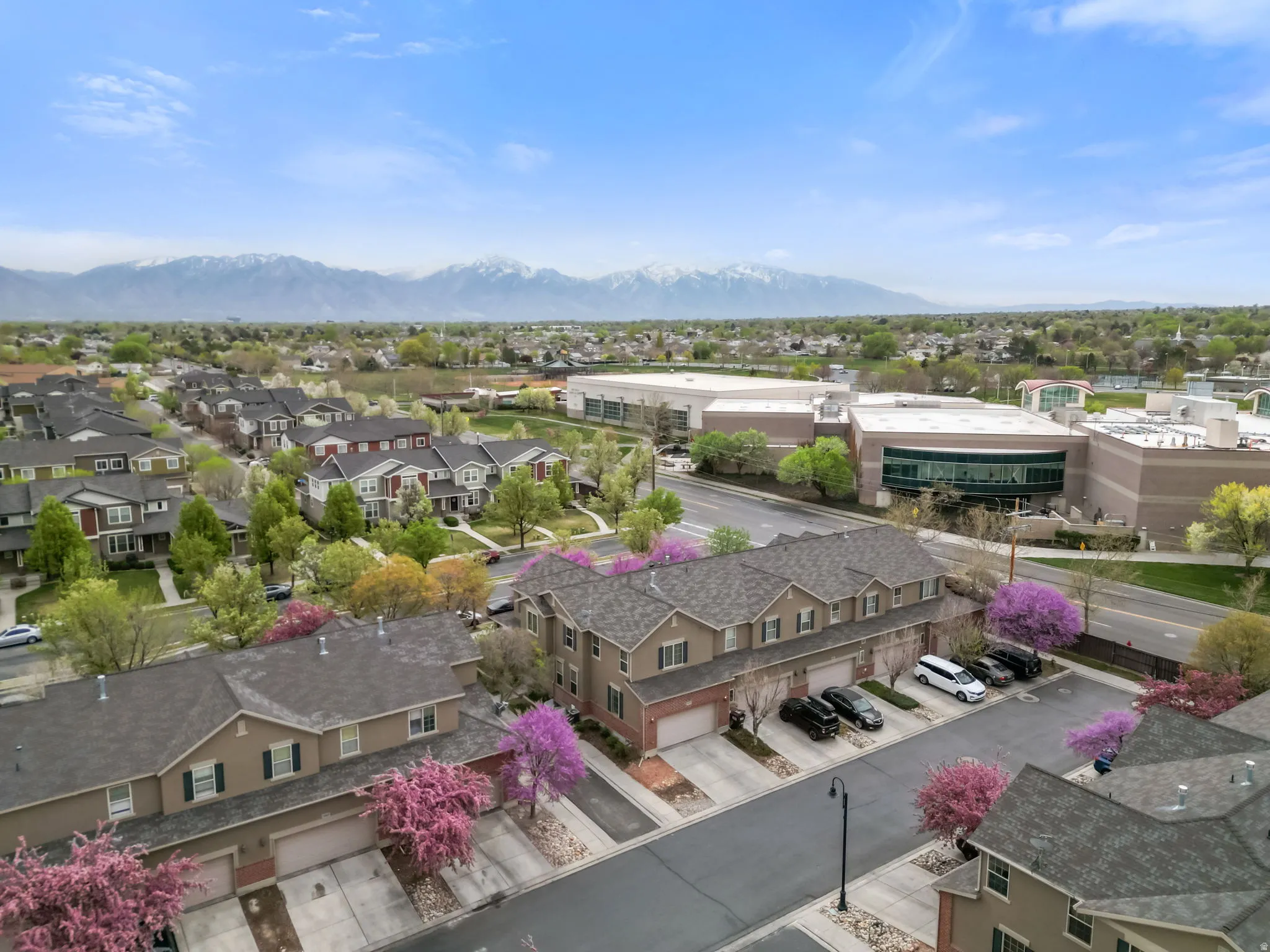 Aerial perspective of suburban area with a mountain backdrop