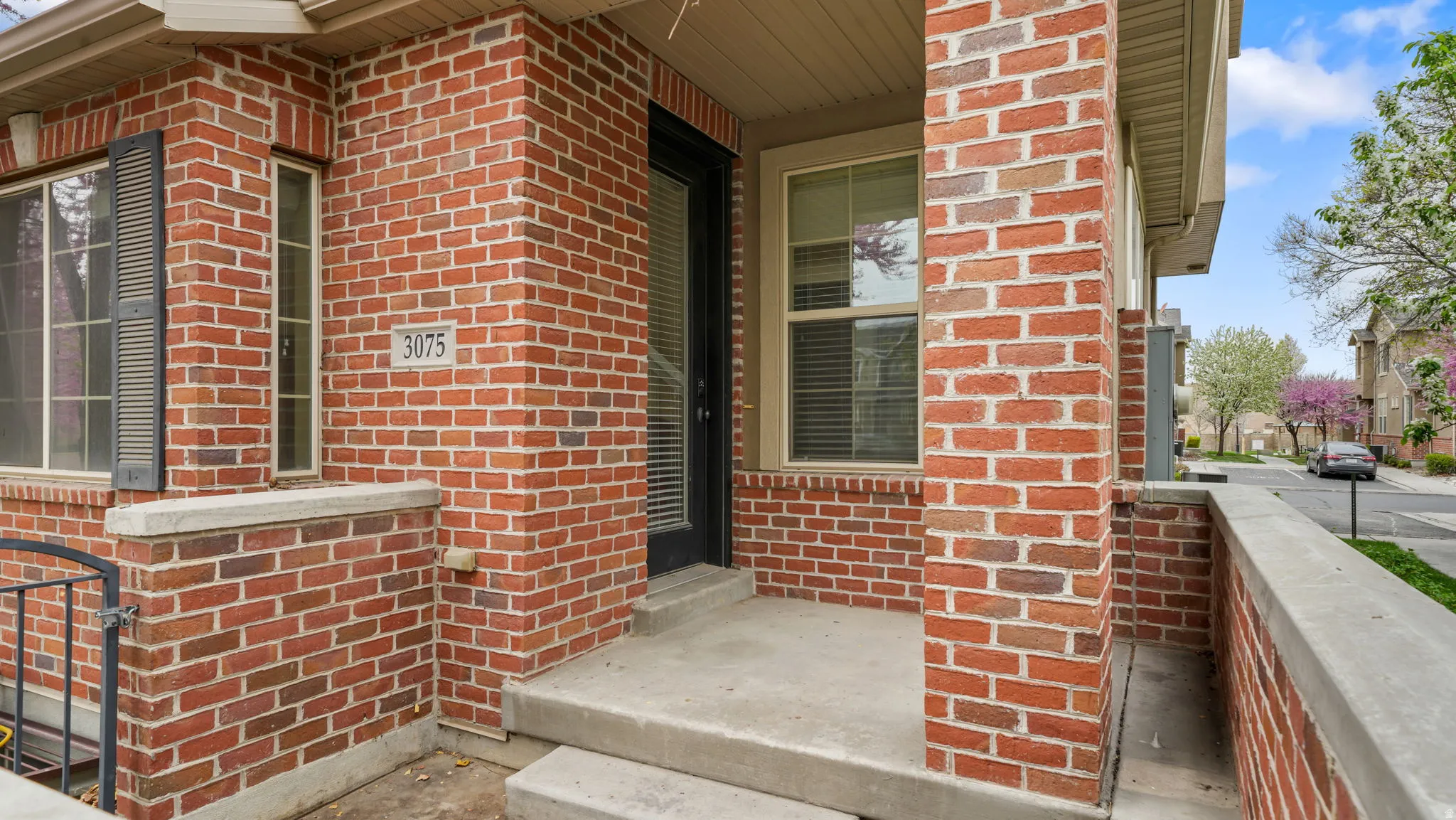 Property entrance with brick siding