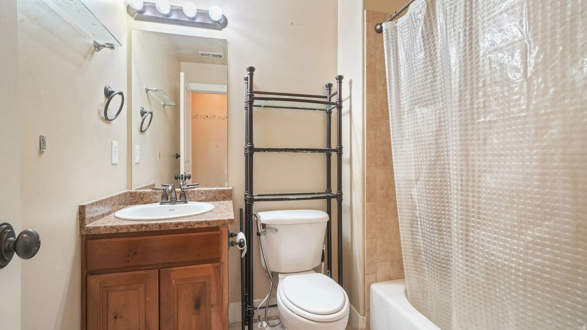 Full bathroom featuring vanity and shower / bath combo