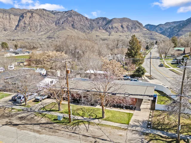 View of mountain backdrop featuring nearby mountain range. Duplex faces west.  Lorin Farr Park with pool is kiddy corner.