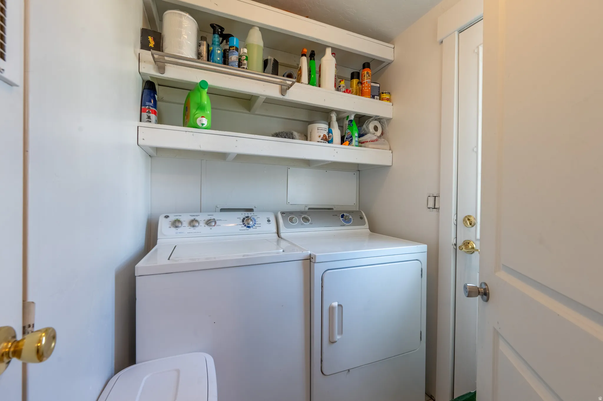 Laundry room featuring separate washer and dryer