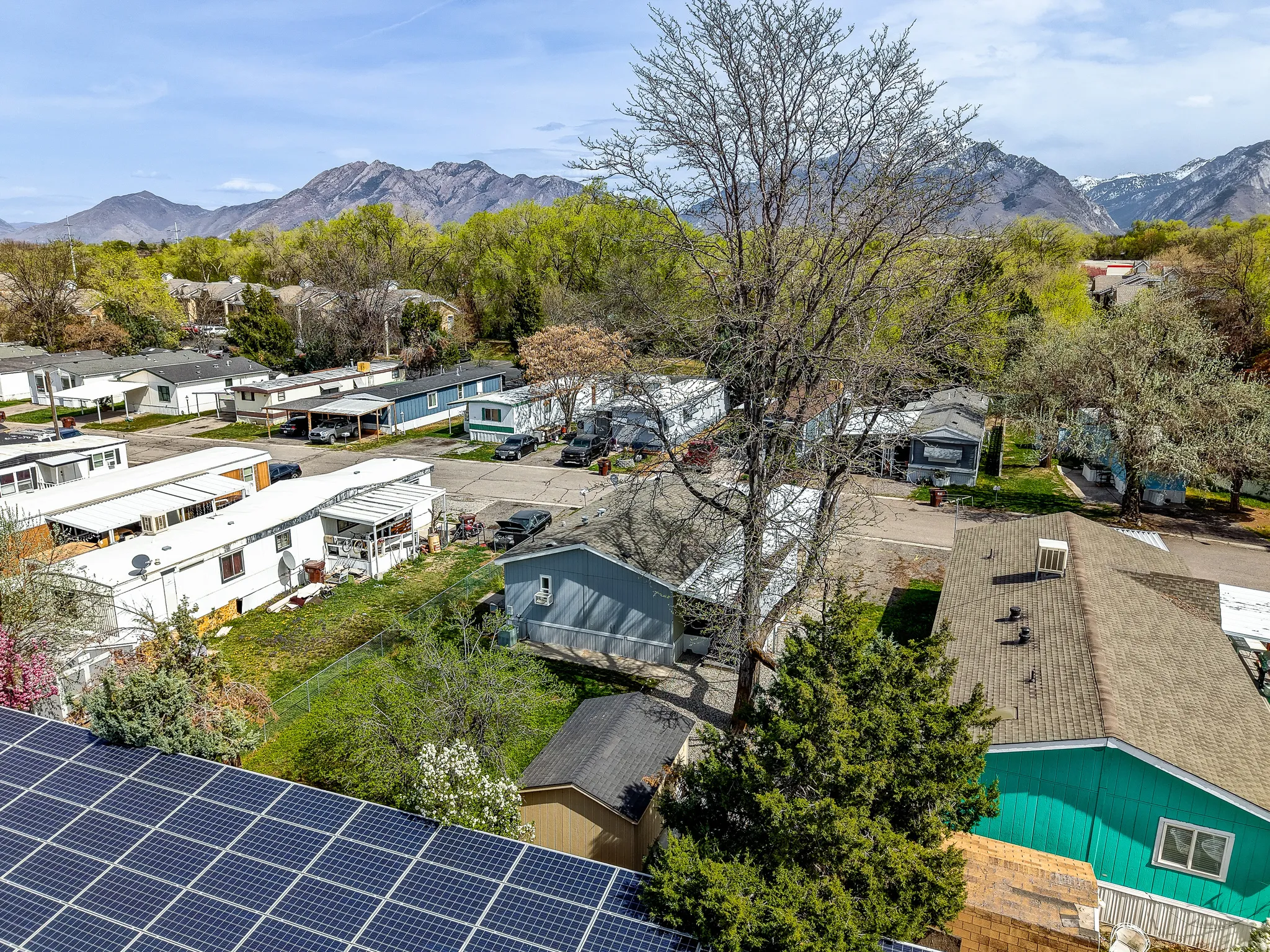 Aerial perspective of suburban area with a mountain backdrop