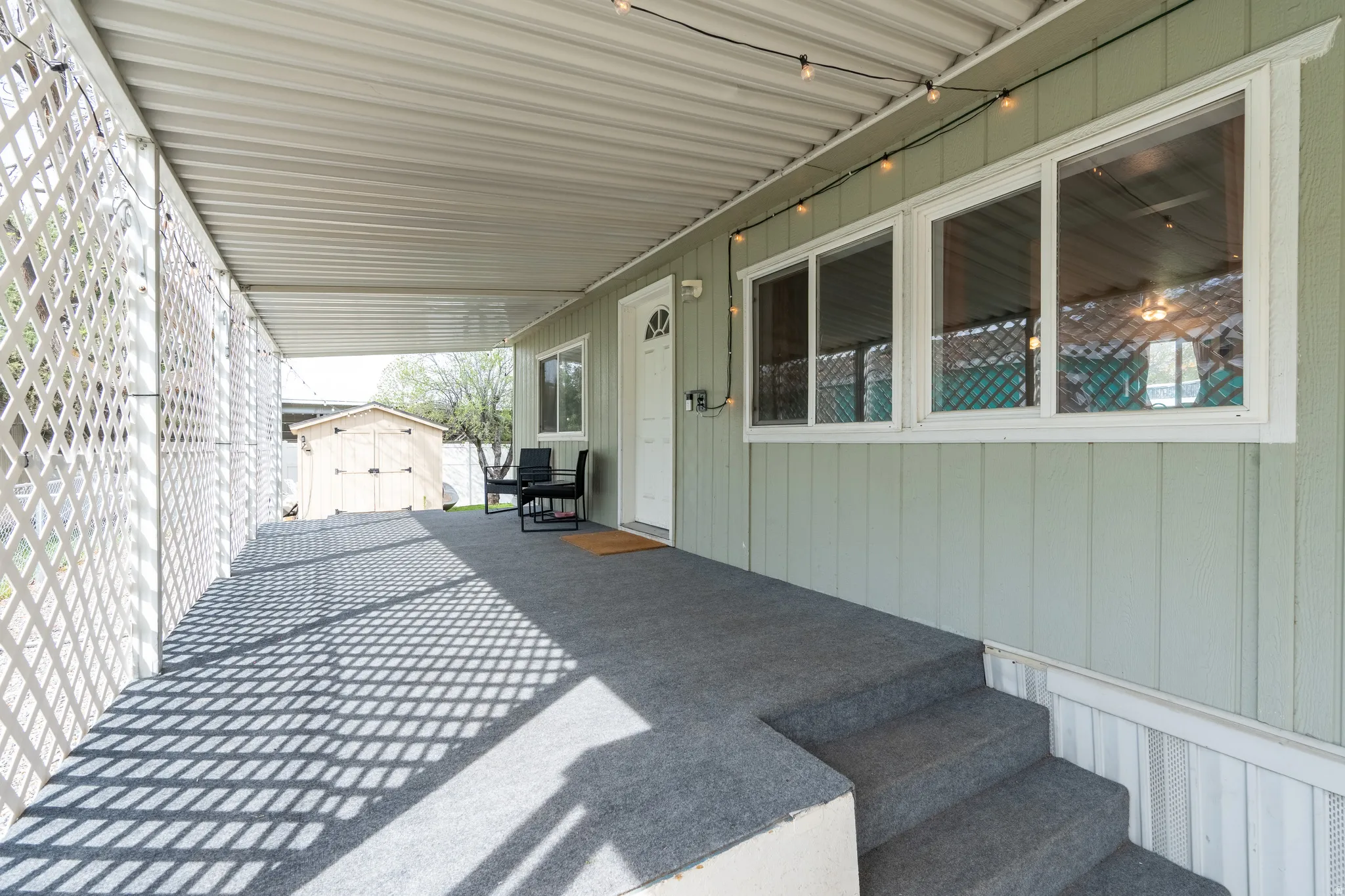 View of patio featuring a shed