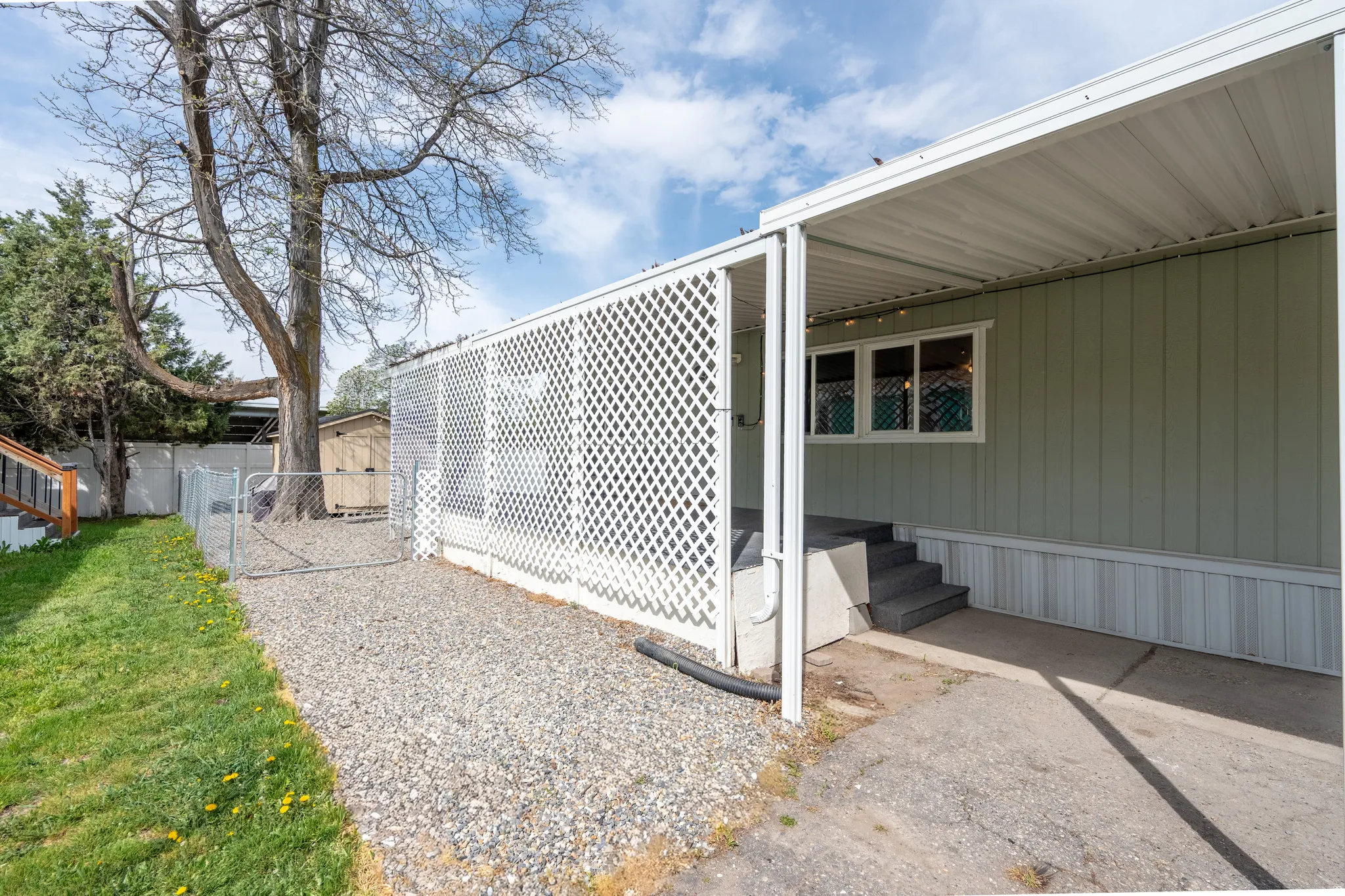 View of home's exterior featuring a storage shed