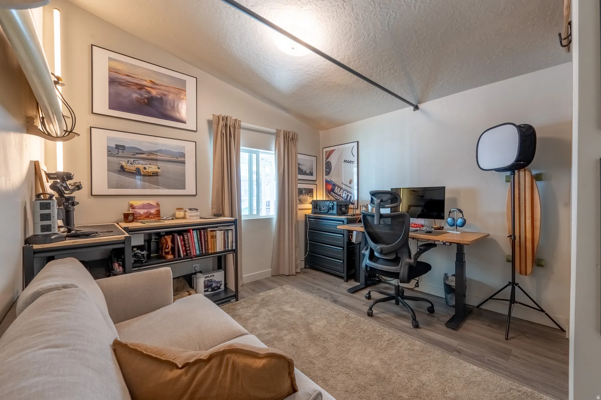 Office space featuring light wood-type flooring and baseboards
