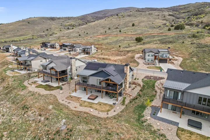 Aerial view of residential area featuring mountains