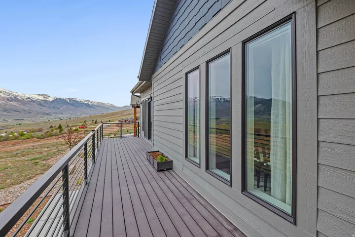 Deck with a mountain view and a view of countryside