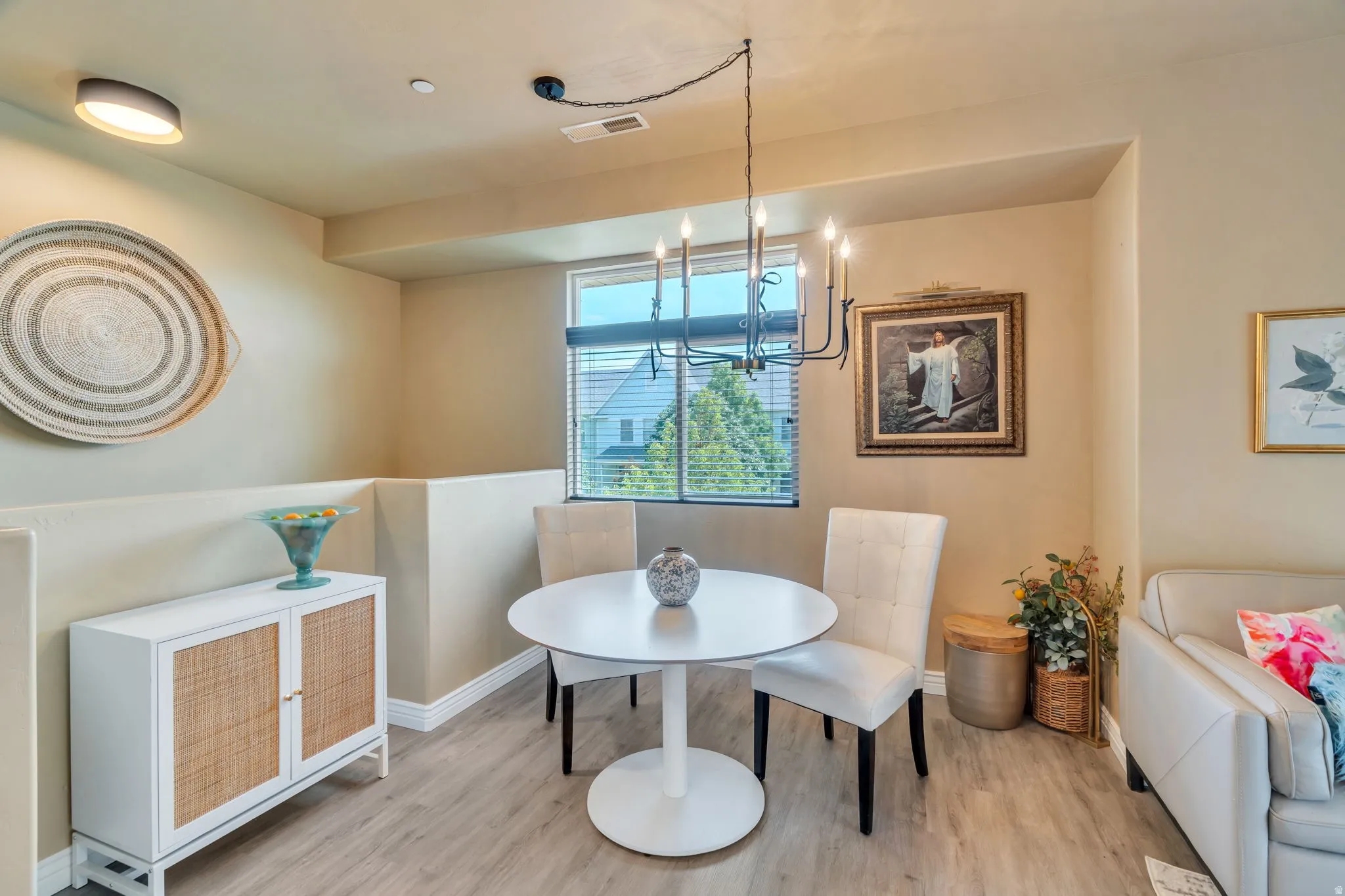 Dining area featuring light wood finished floors and baseboards