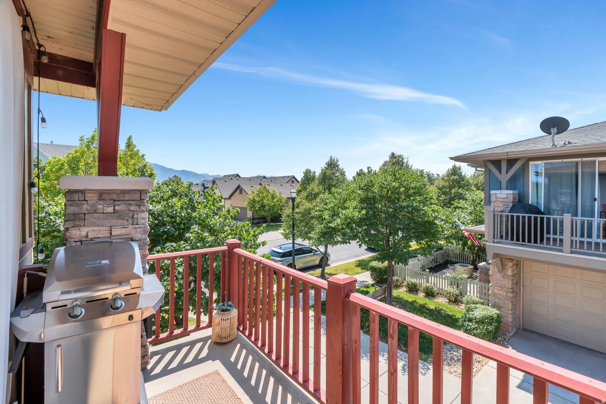 Balcony featuring a grill and a residential view