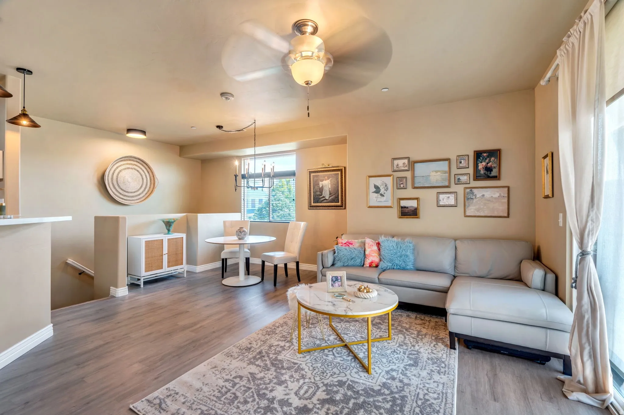 Living room with a ceiling fan and wood finished floors