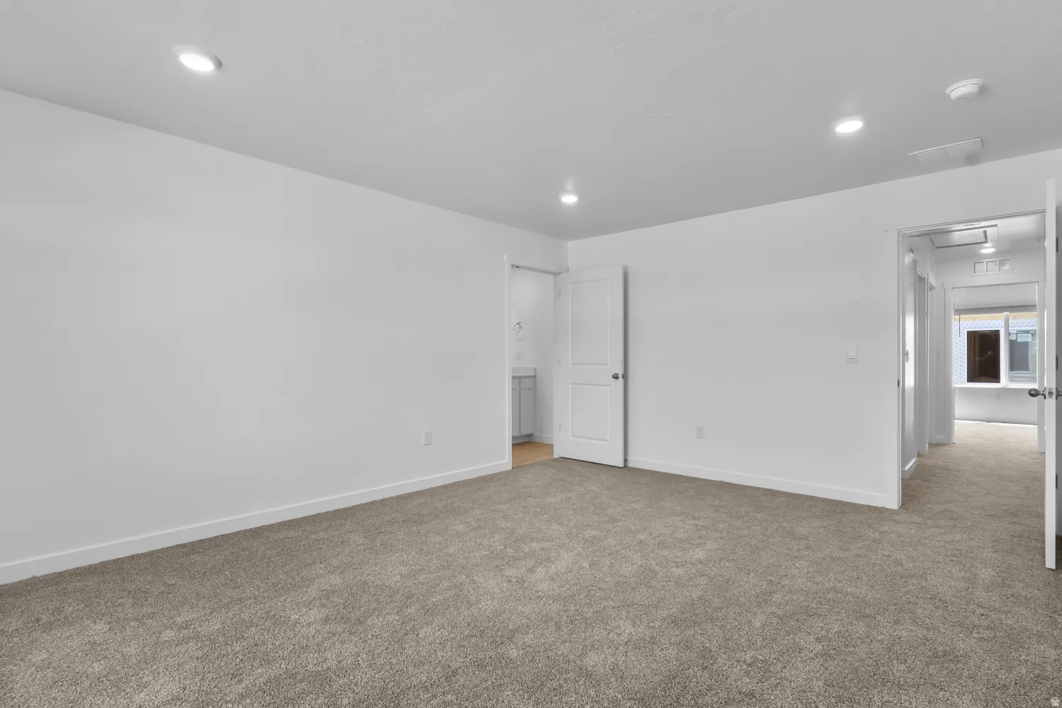 Unfurnished bedroom with carpet flooring and recessed lighting