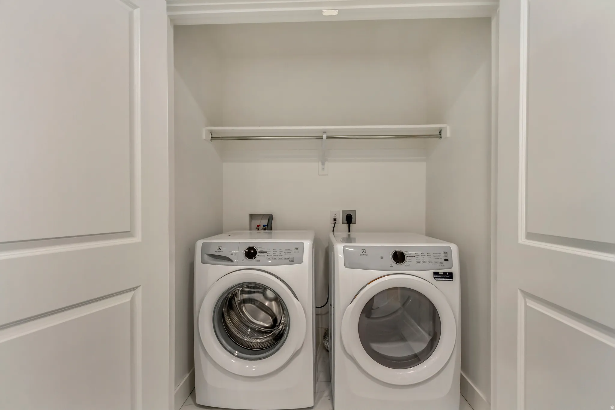 Laundry area featuring independent washer and dryer