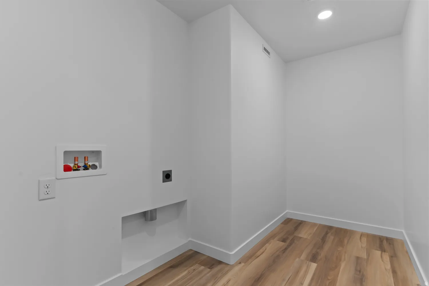 Laundry room featuring light wood-style flooring, recessed lighting, hookup for a washing machine, and hookup for an electric dryer