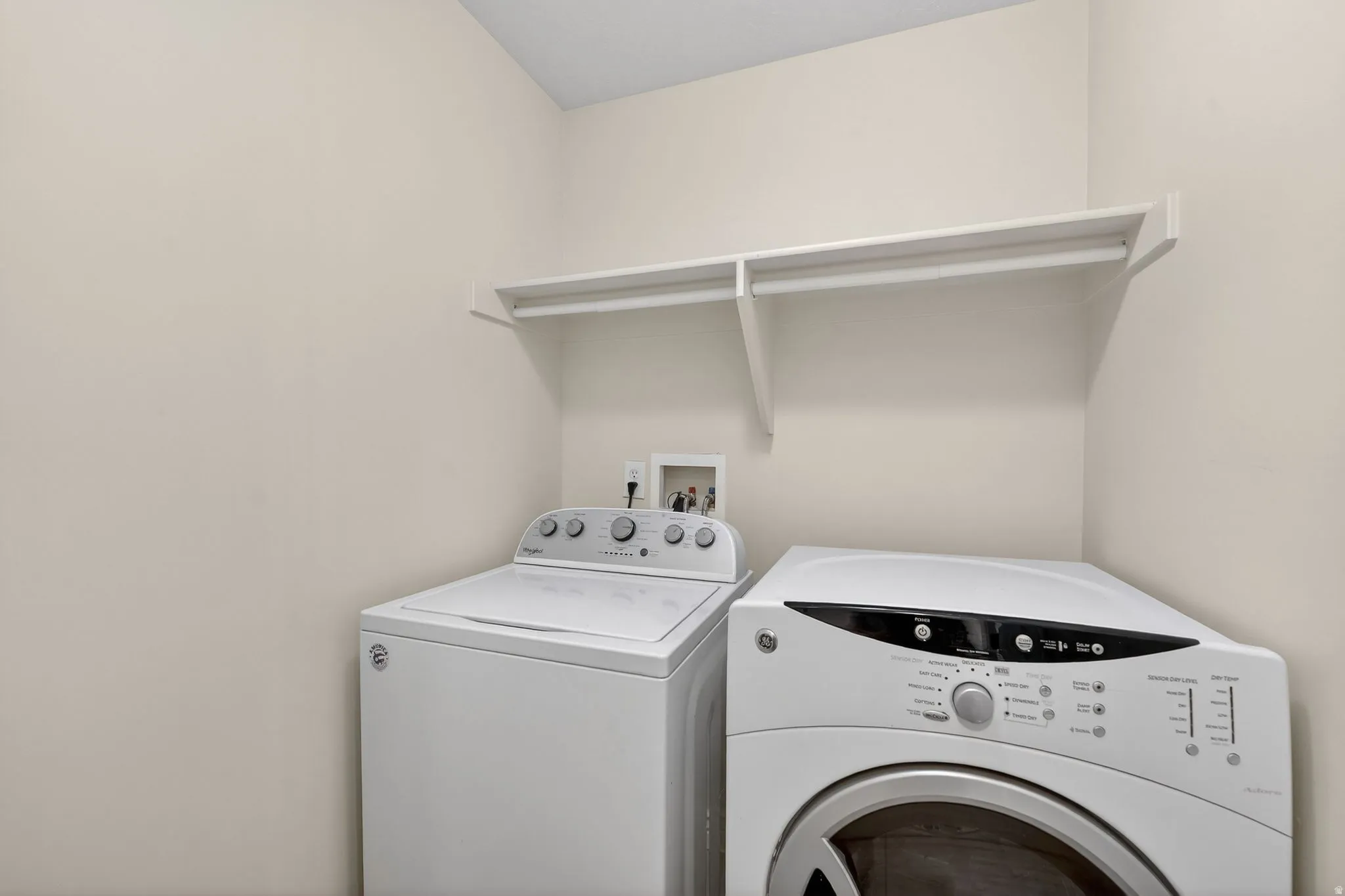 Laundry room featuring separate washer and dryer