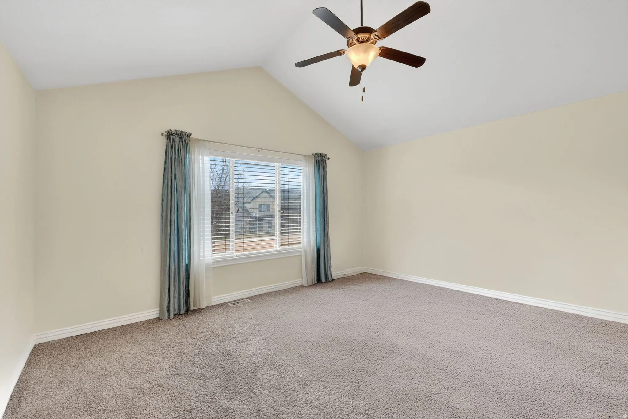 Unfurnished room with carpet floors and ceiling fan