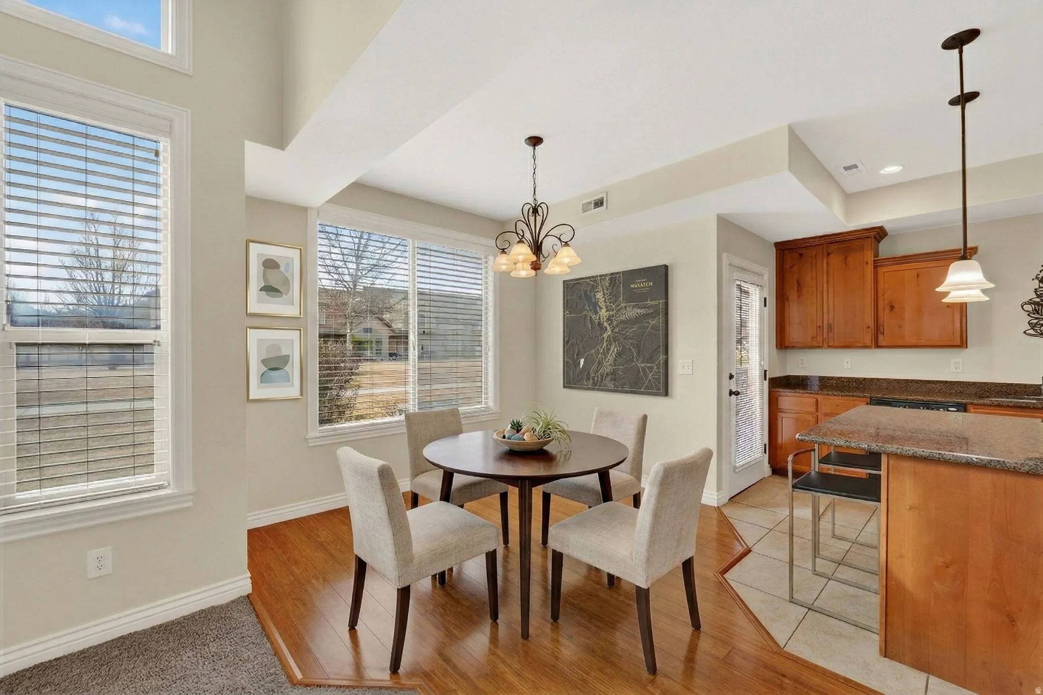 Dining area featuring a chandelier and light wood-type flooring