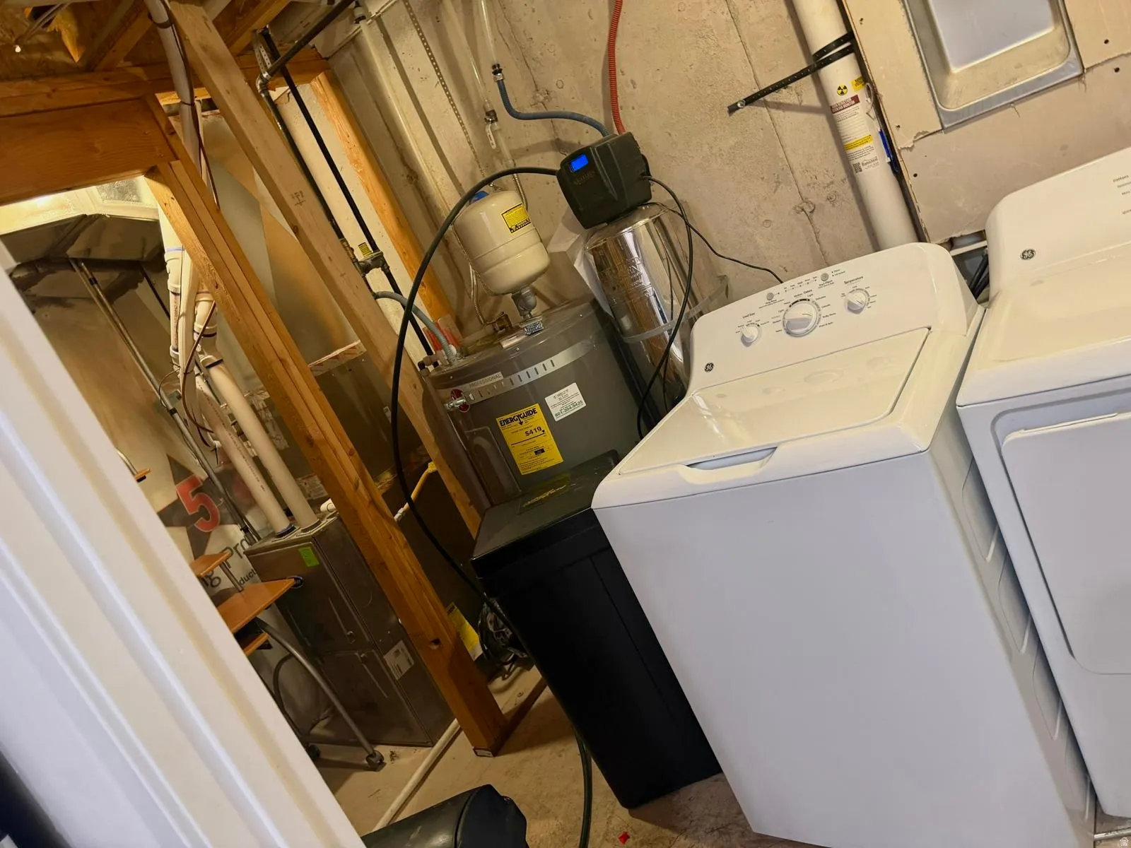 Laundry area with washing machine and clothes dryer