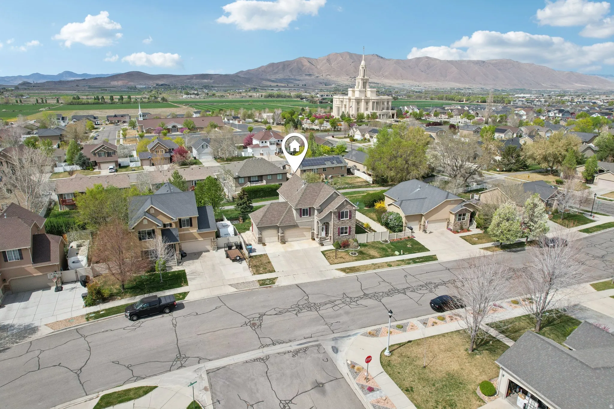 Aerial view of residential area featuring a mountain backdrop