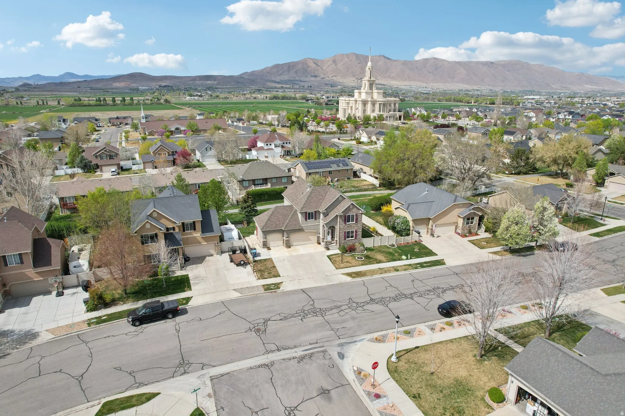 Aerial perspective of suburban area featuring a mountainous background