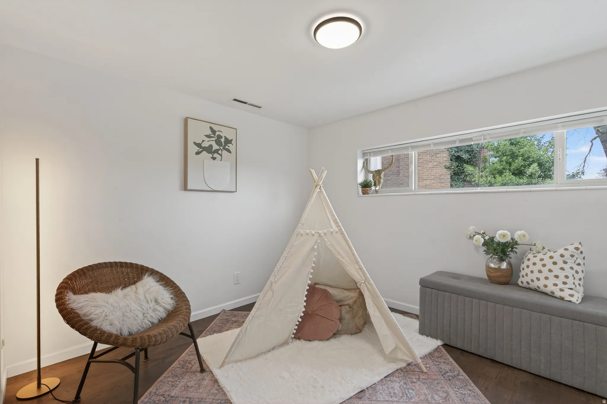 Bedroom featuring wood LVP floors and baseboards