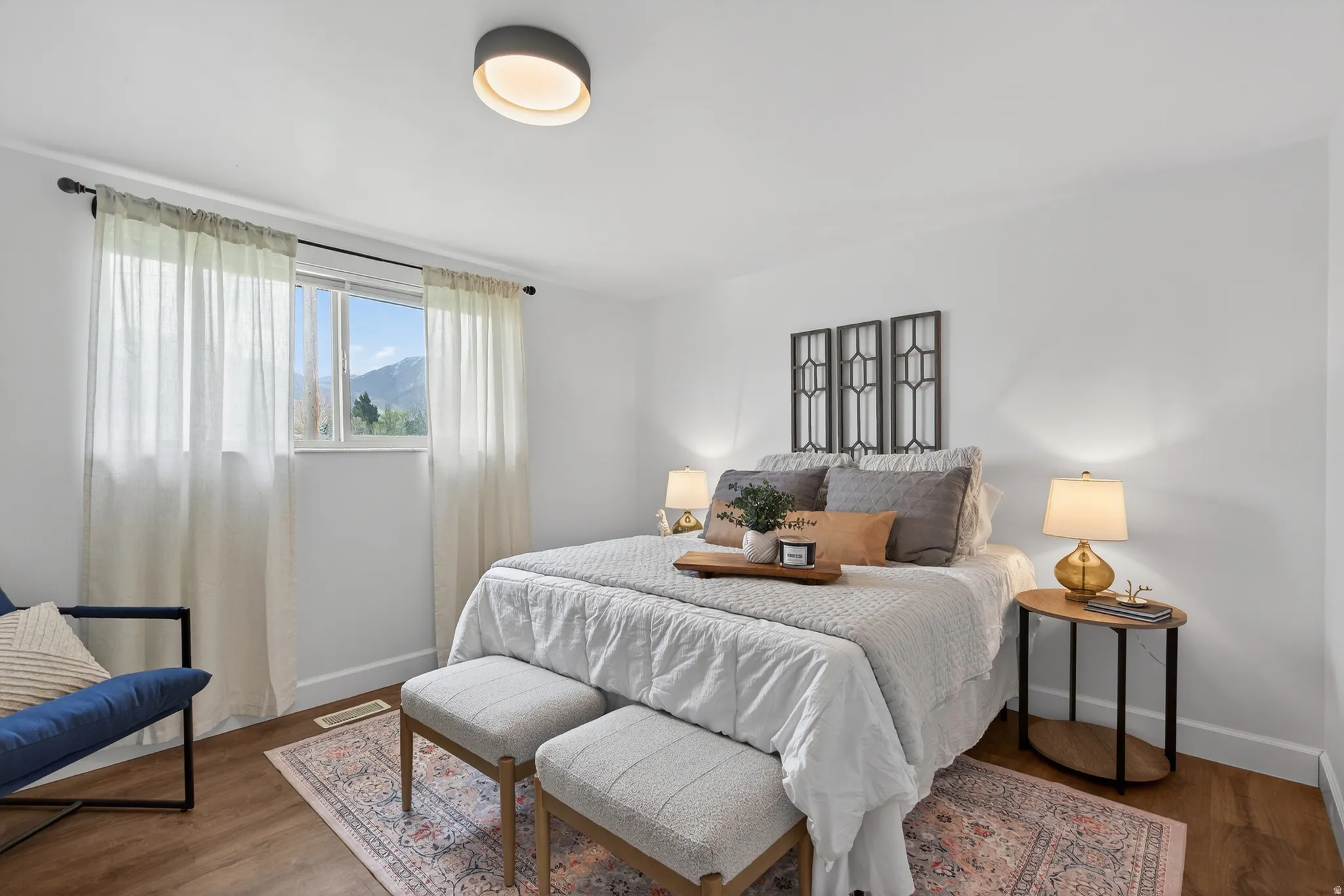 Primary Bedroom with LVP floors and mountain views