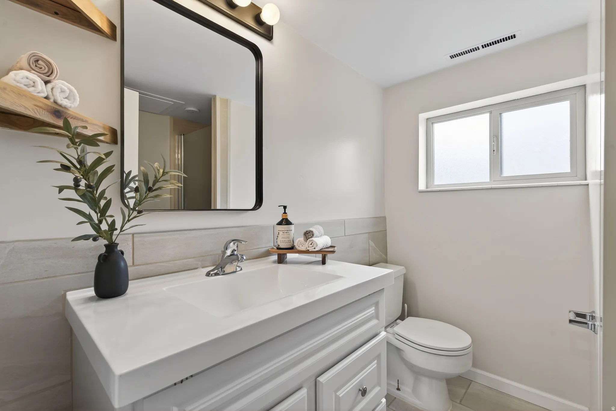 3/4 bathroom featuring vanity and tile flooring