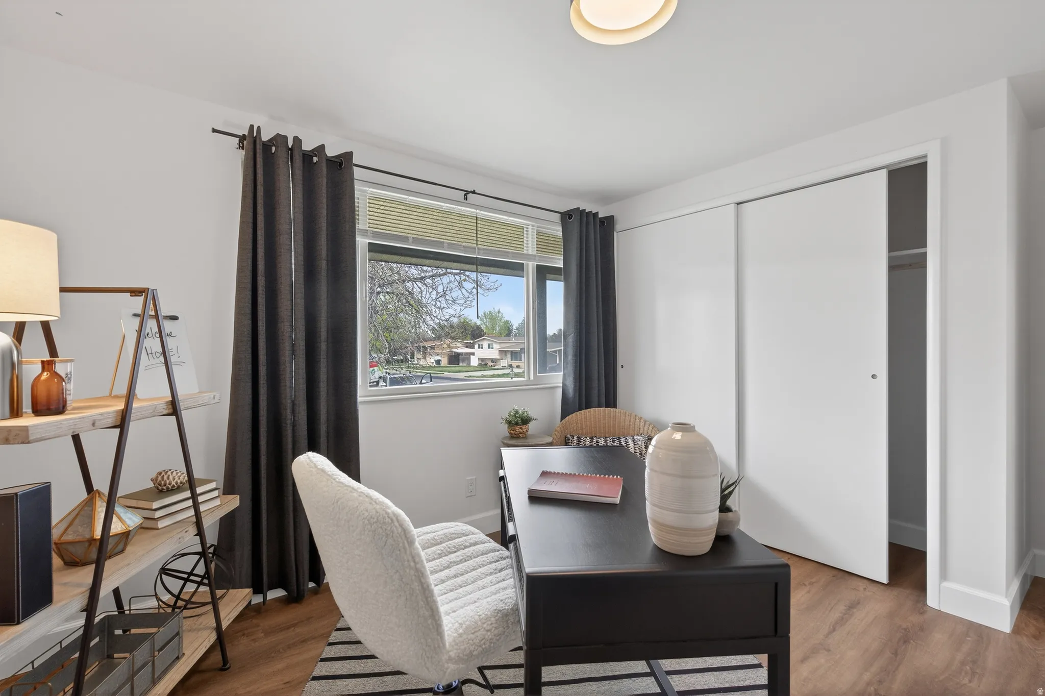 Home office featuring wood finished floors