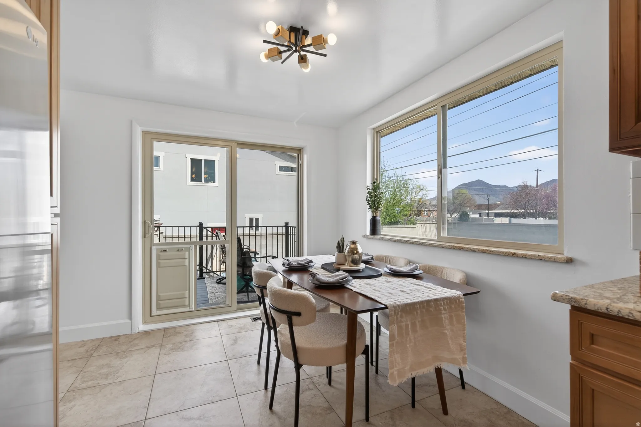 Dining room with flush mount lights and  tile flooring