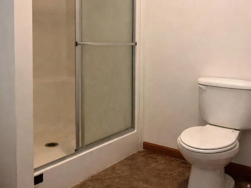 Primary bathroom featuring walk in shower