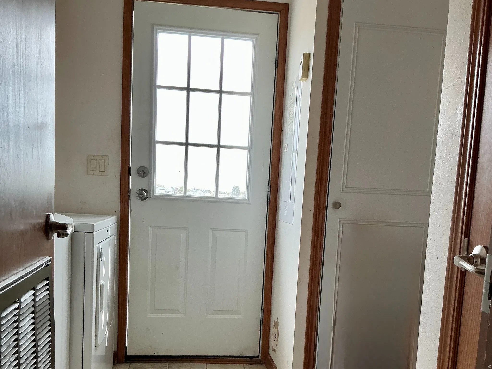 Laundry room with door to the back yard