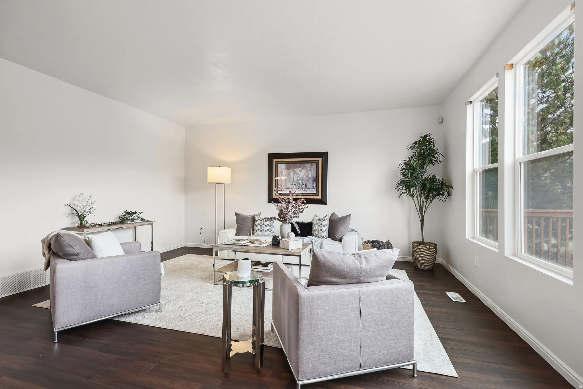 Living room with dark wood-type flooring