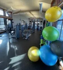 Gym featuring vaulted ceiling