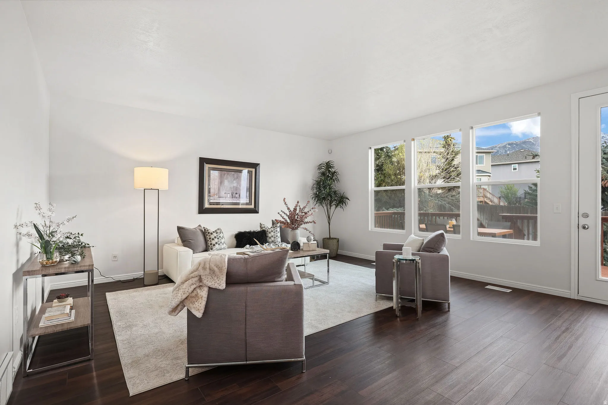 Living area featuring dark wood-style floors