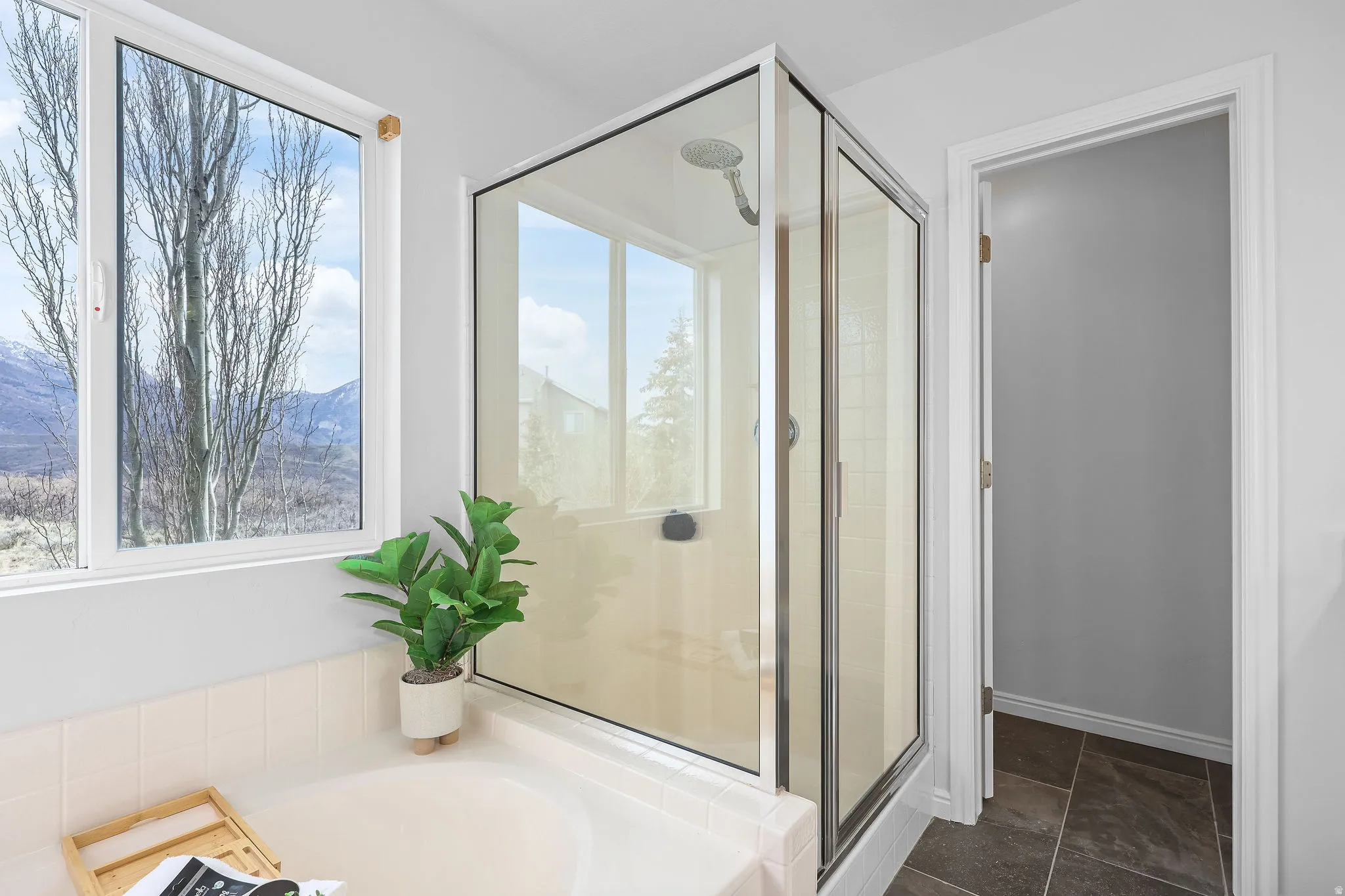 Full bathroom with a shower stall and a garden tub