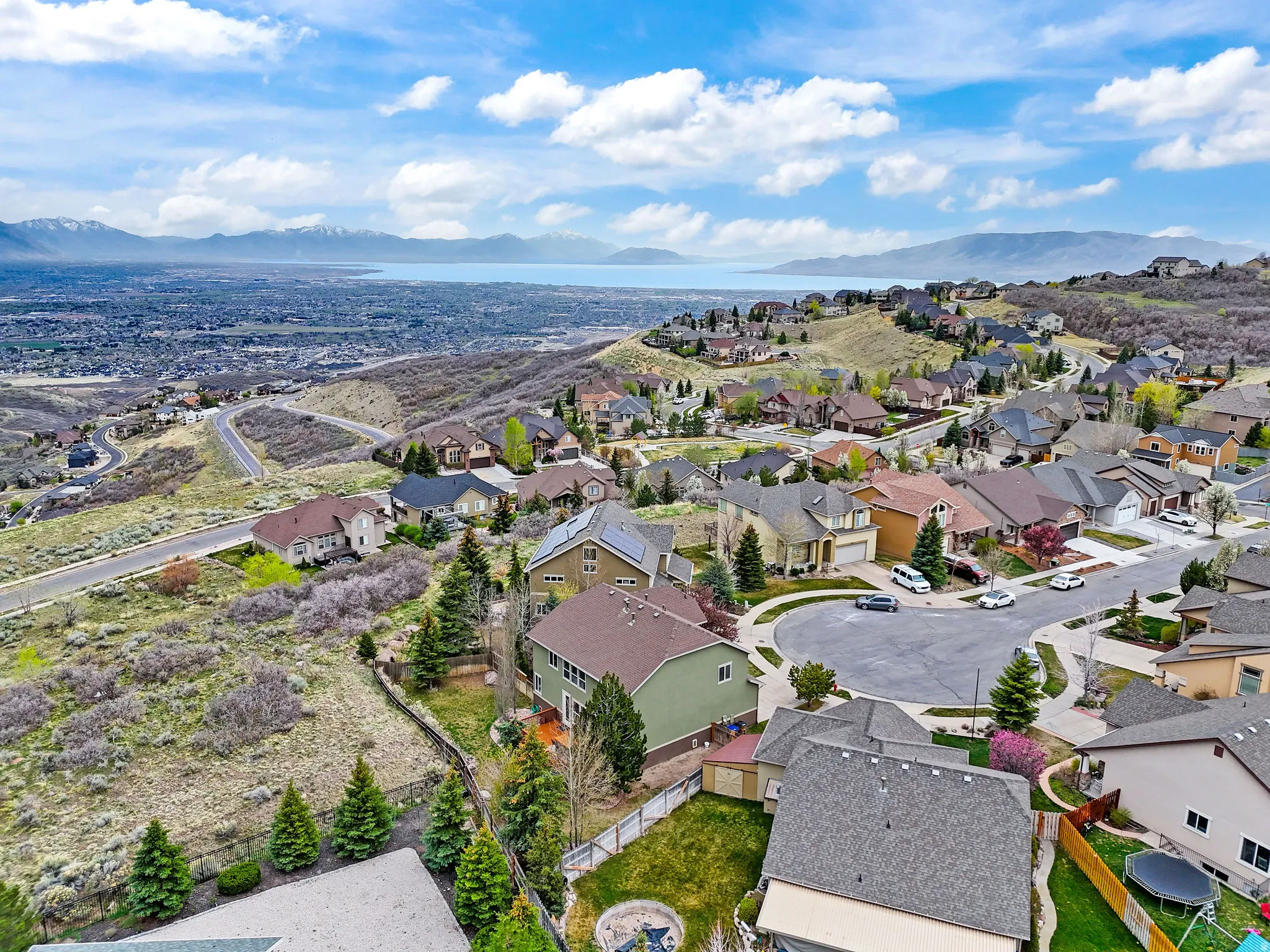 Aerial perspective of suburban area featuring a mountain backdrop
