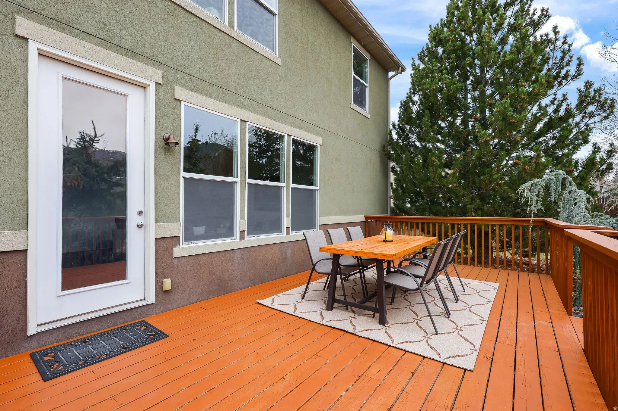 Wooden terrace featuring outdoor dining area
